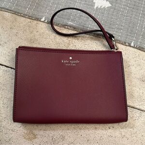Kate Spade cranberry/wine colored Wristlet